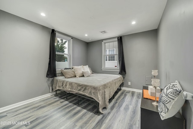 bedroom with hardwood / wood-style flooring