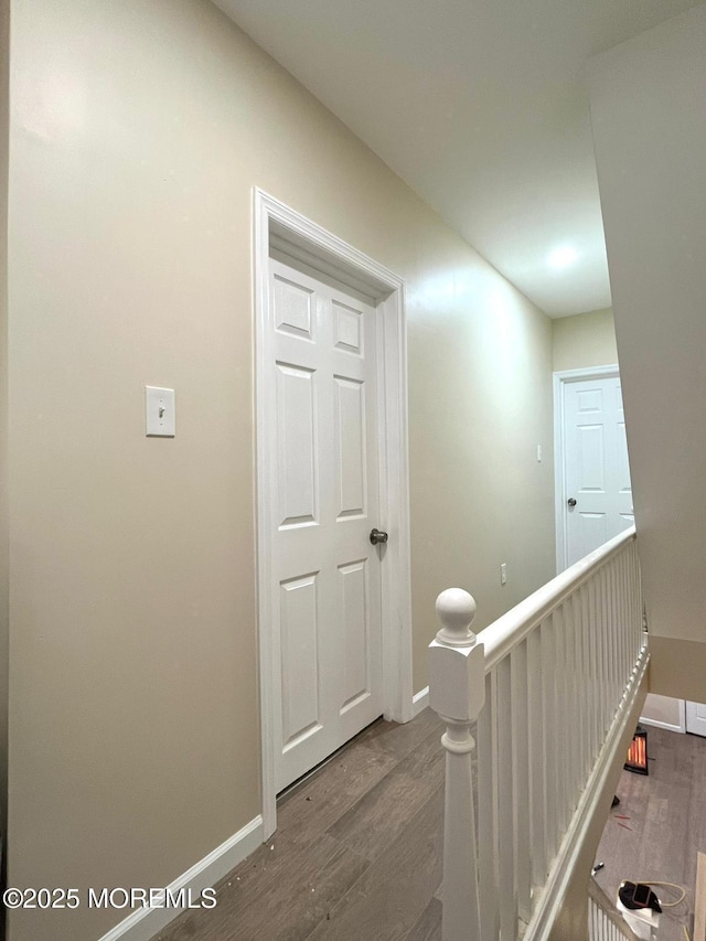 hallway featuring dark hardwood / wood-style flooring