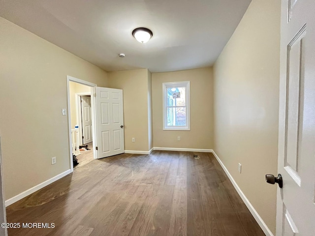 unfurnished room featuring wood-type flooring