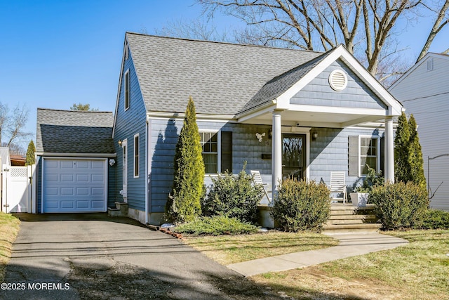 view of front of house featuring a garage and covered porch