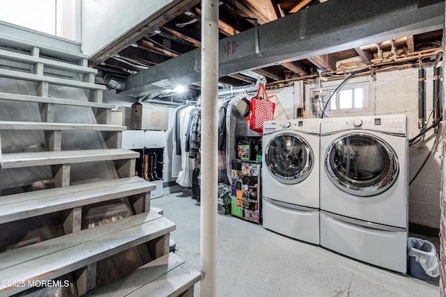 basement with washing machine and clothes dryer