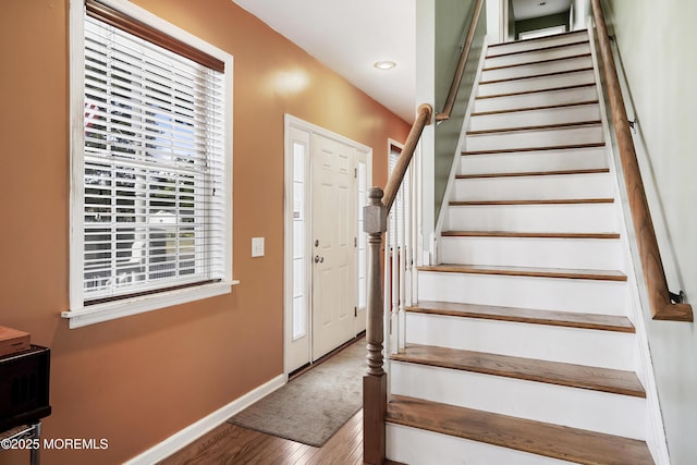 staircase featuring hardwood / wood-style floors