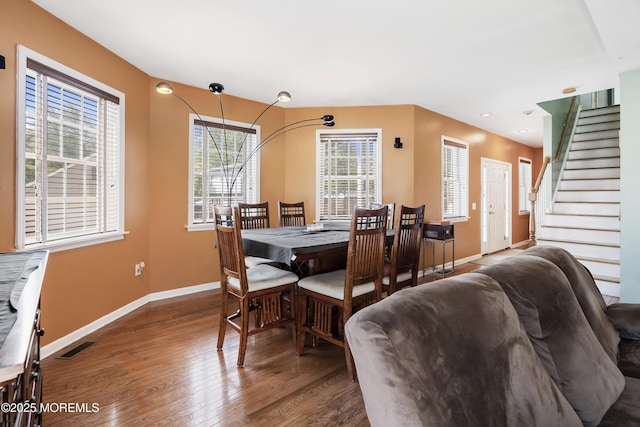 dining area with hardwood / wood-style flooring