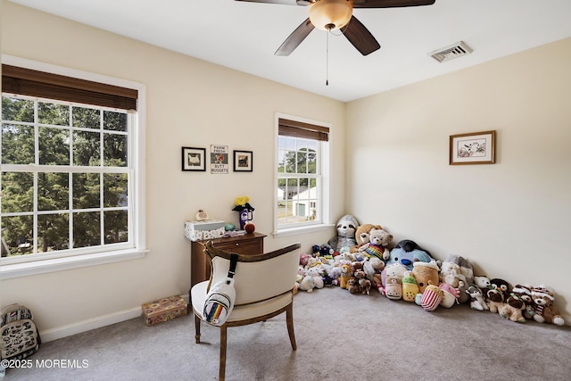 sitting room featuring carpet floors and ceiling fan