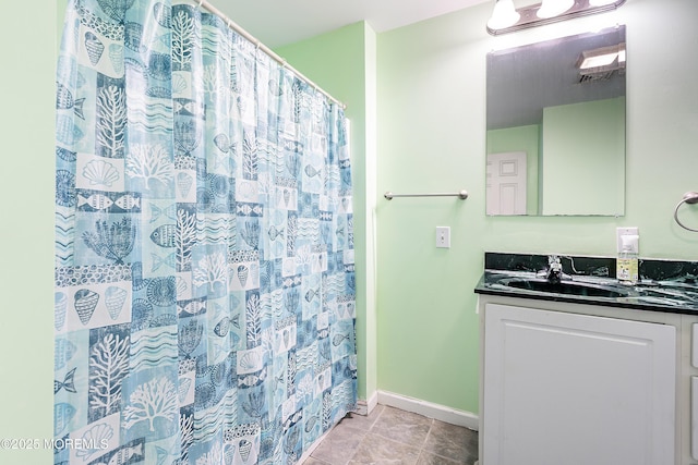 bathroom featuring a shower with curtain and vanity