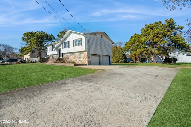 view of side of home with a garage and a yard