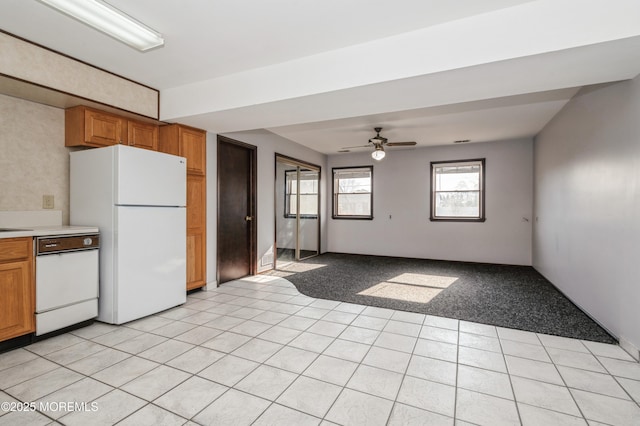 kitchen with ceiling fan, light colored carpet, and white appliances