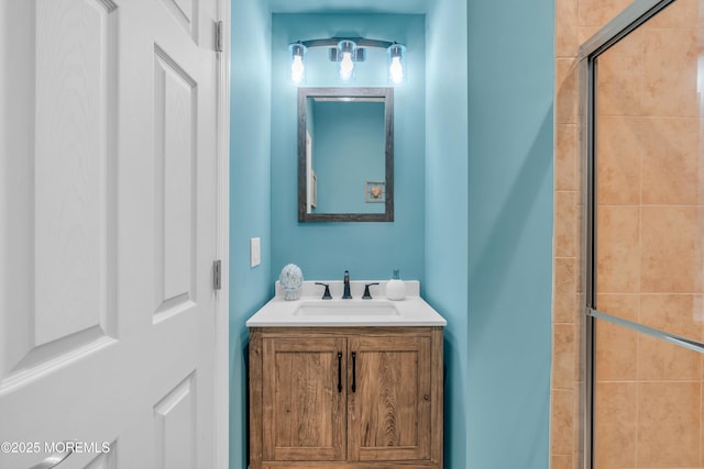 bathroom with vanity and an enclosed shower