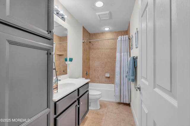 full bathroom featuring vanity, tile patterned flooring, shower / bathtub combination with curtain, and toilet