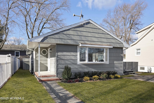 bungalow-style house featuring a front yard