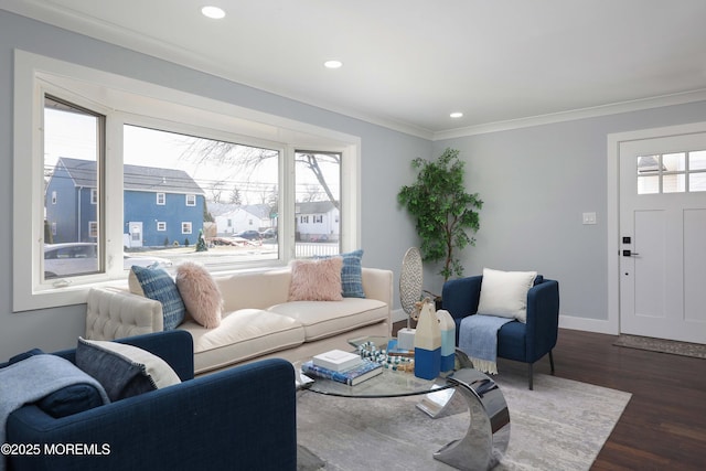 living room featuring dark hardwood / wood-style flooring and crown molding