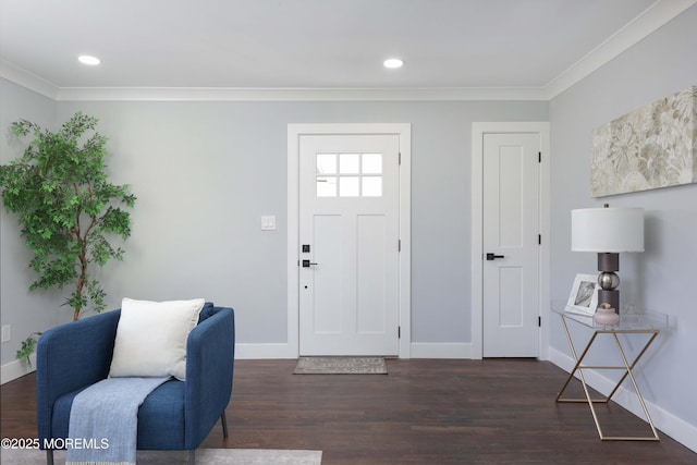 foyer with dark hardwood / wood-style flooring and crown molding