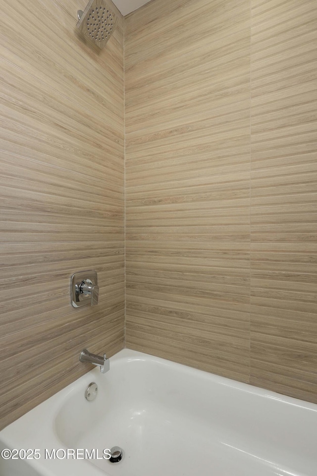 bathroom featuring washtub / shower combination