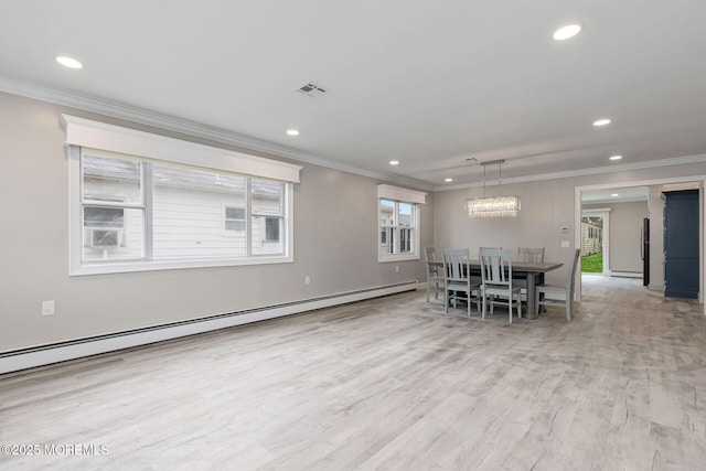 unfurnished dining area featuring ornamental molding, light hardwood / wood-style floors, and a baseboard heating unit