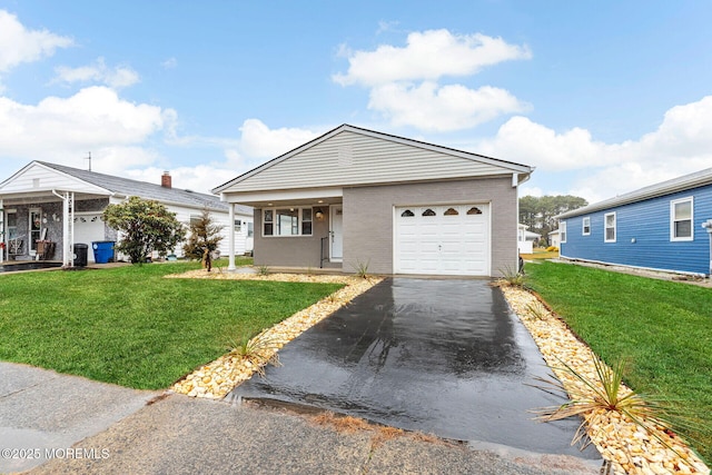 view of front of house with a front lawn and a garage