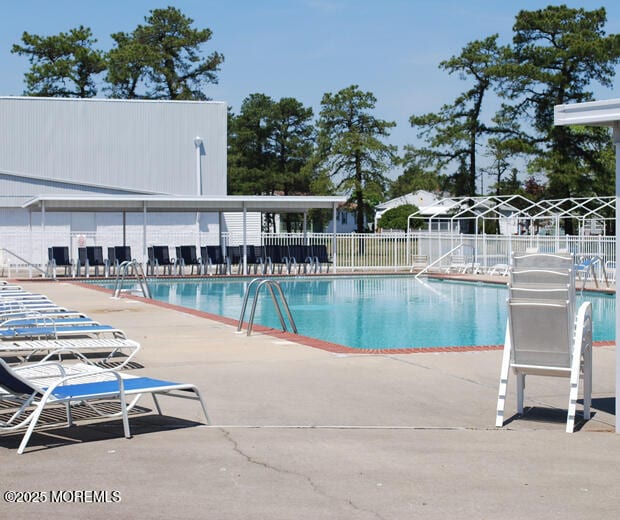 view of pool featuring a patio area