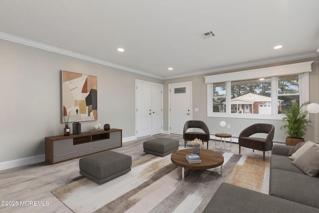 living room featuring light hardwood / wood-style flooring, crown molding, and a baseboard heating unit