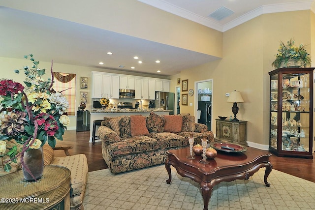 living room with ornamental molding and light wood-type flooring