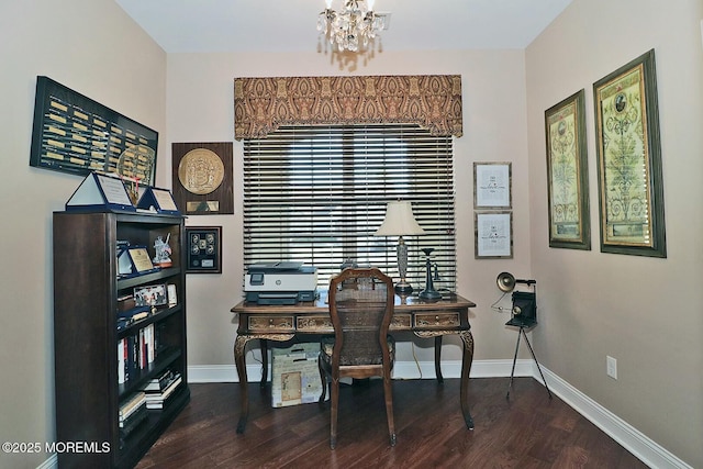 home office featuring an inviting chandelier and dark hardwood / wood-style floors