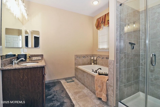 bathroom with vanity, tile patterned flooring, and independent shower and bath