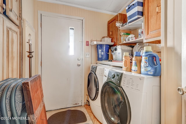 washroom with crown molding, cabinets, and independent washer and dryer