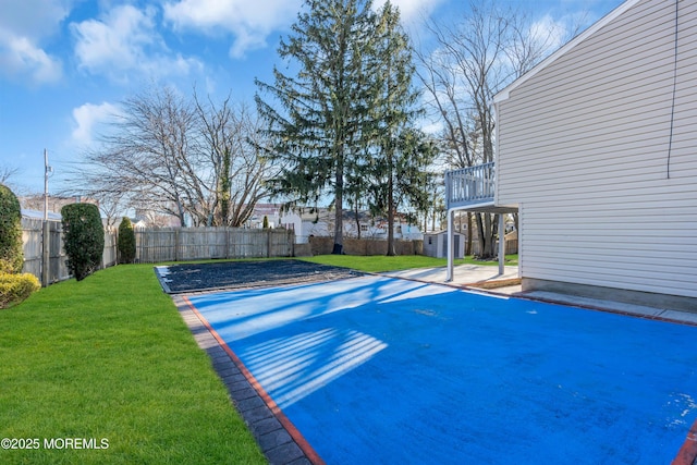 view of pool featuring a lawn