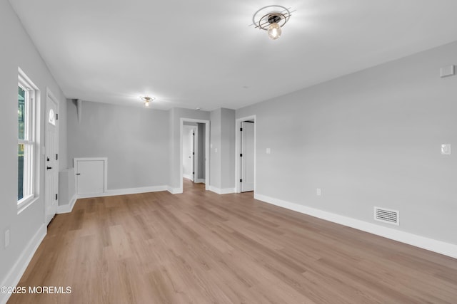 spare room featuring light hardwood / wood-style flooring