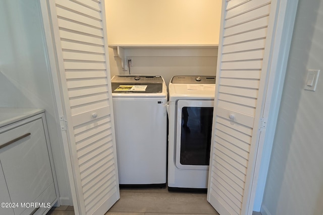 washroom with washer and clothes dryer