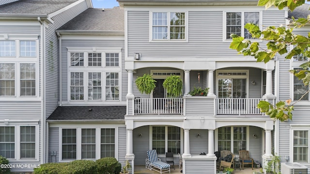 rear view of house featuring a patio