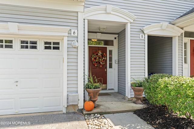 property entrance featuring a garage