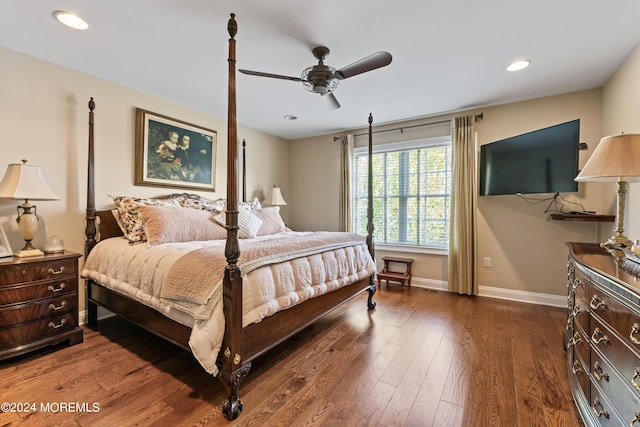 bedroom with ceiling fan and dark hardwood / wood-style flooring