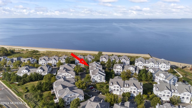 bird's eye view featuring a beach view and a water view