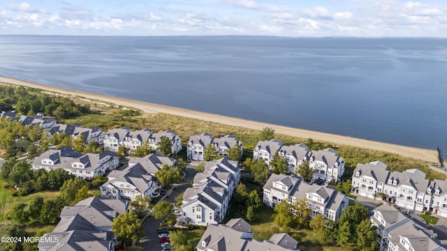 bird's eye view with a beach view and a water view