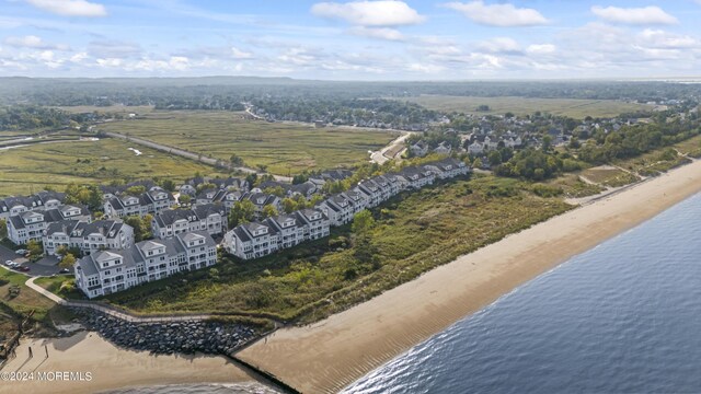 bird's eye view with a beach view and a water view