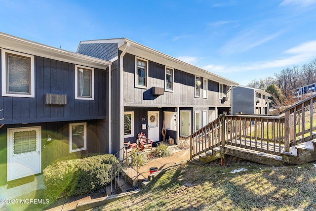 exterior space with a patio area, a wooden deck, and a yard