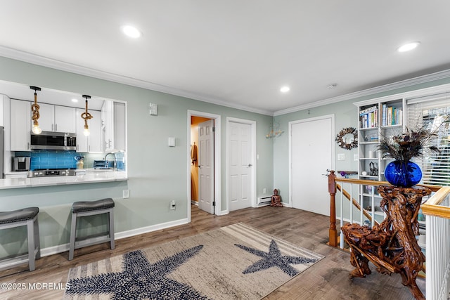 interior space featuring white cabinetry, stainless steel appliances, dark hardwood / wood-style floors, backsplash, and pendant lighting