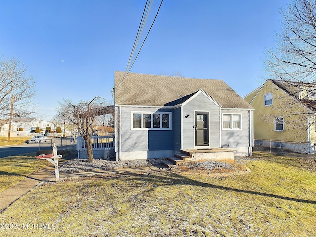 bungalow-style home featuring a front yard