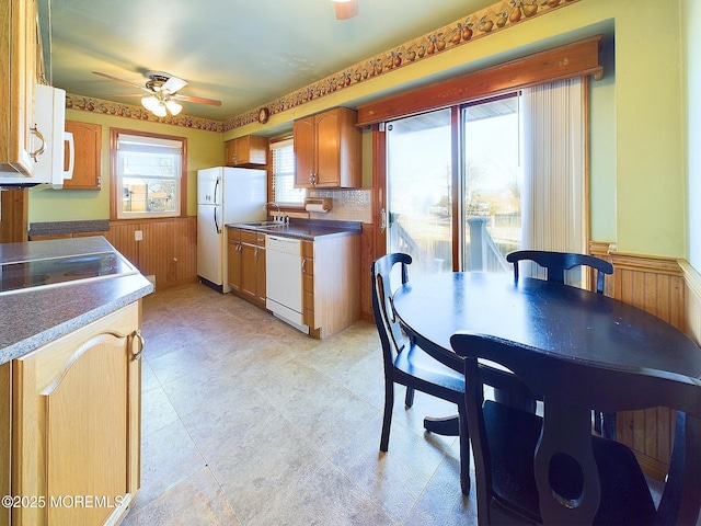 kitchen with white appliances, ceiling fan, and sink