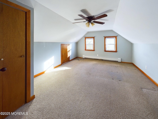 bonus room featuring lofted ceiling, baseboard heating, ceiling fan, and light carpet