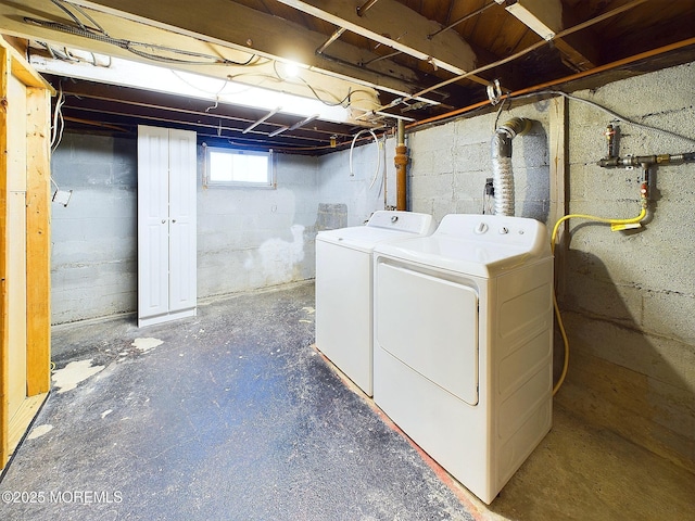 clothes washing area featuring washing machine and clothes dryer