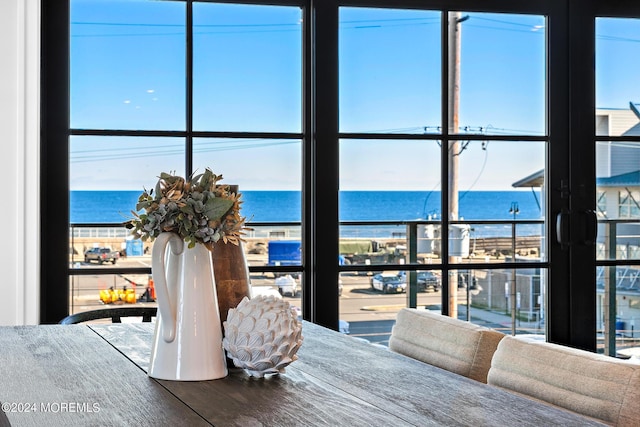 dining room featuring a water view