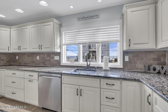 kitchen featuring sink, white cabinets, and stainless steel dishwasher