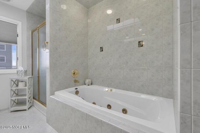 bathroom with independent shower and bath and tile patterned flooring