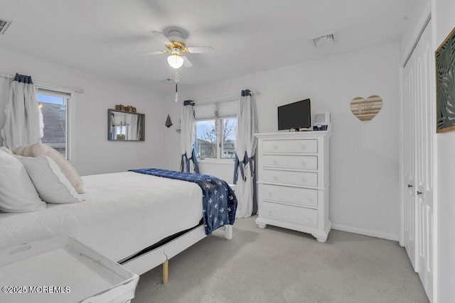 bedroom with ceiling fan and a closet