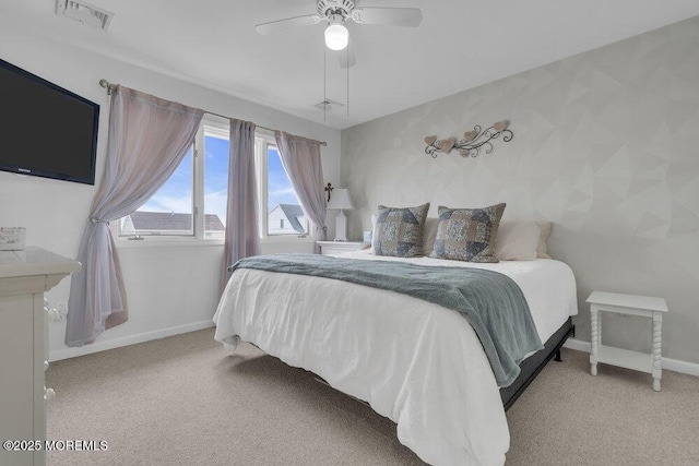 bedroom featuring ceiling fan and light carpet