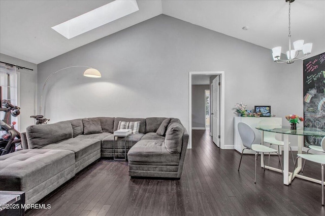 living room with high vaulted ceiling, a skylight, a chandelier, and dark hardwood / wood-style floors