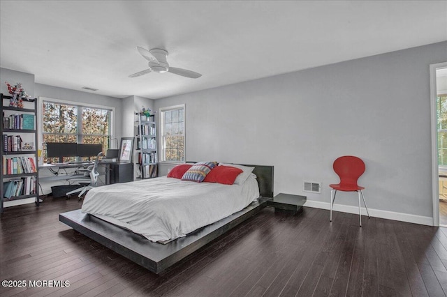 bedroom featuring dark wood-type flooring and ceiling fan