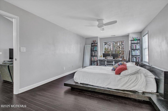 bedroom featuring dark wood-type flooring and ceiling fan