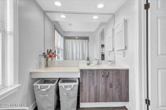 bathroom with vanity and a healthy amount of sunlight