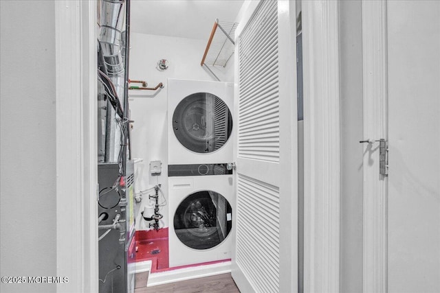 washroom with stacked washer / drying machine